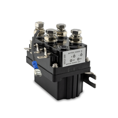 A black 50 Amp 12-volt solenoid for anchor winches, with visible terminal connections and a label indicating battery power input.