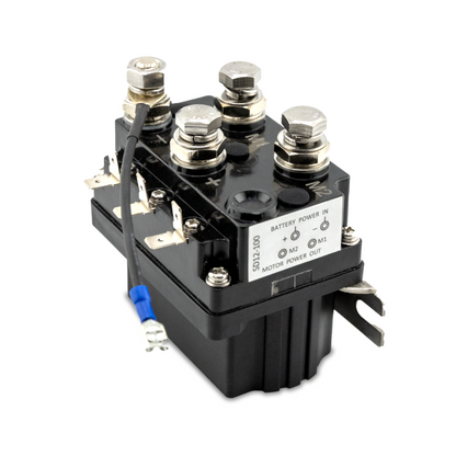 A black 100 Amp 12-volt solenoid for anchor winches, with visible terminal connections and a label indicating battery power input.