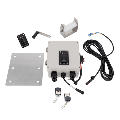 Electrical control panel with wiring, switches, and remote controls on a white background