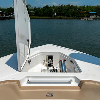 Close-up of a boat's open door with water and trees in the background