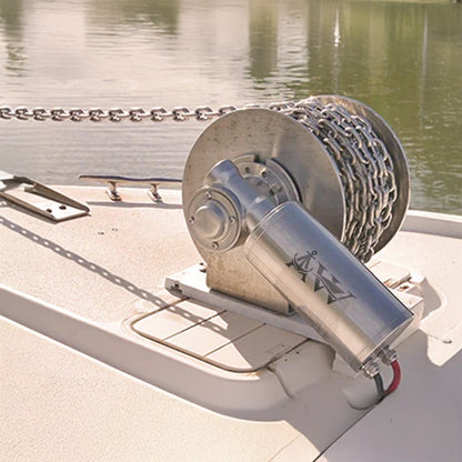 Marine winch on a boat with water in the background
