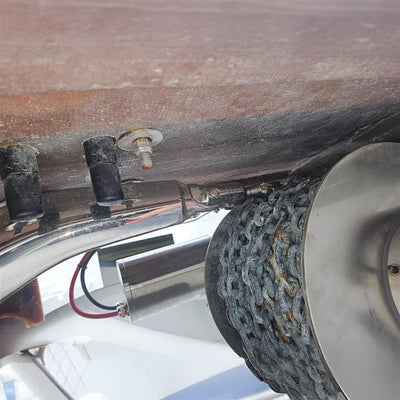 Close-up of a mechanical component with a chain and pulley system.